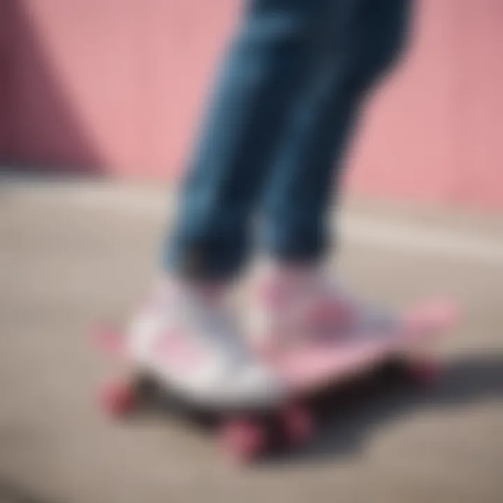 Group of skateboarders showcasing their Adidas white with pink stripes