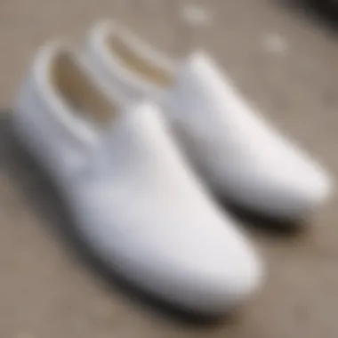 Close-up of the white on white slip-on Vans highlighting its unique design details