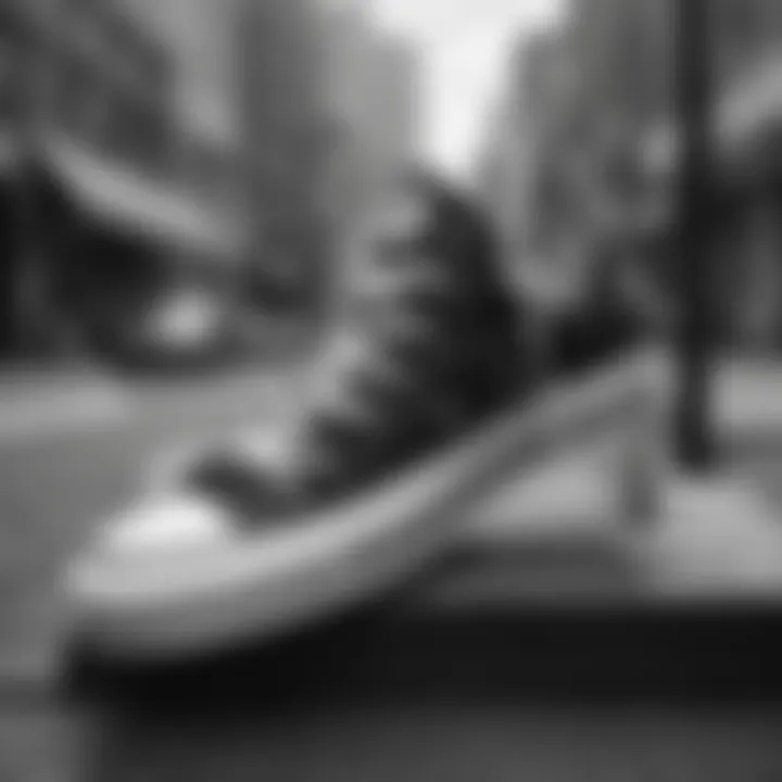 Stylish black and white platform Converse low tops on a city street