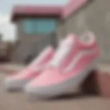 Stylish pink and white Old Skool Vans on a skatepark