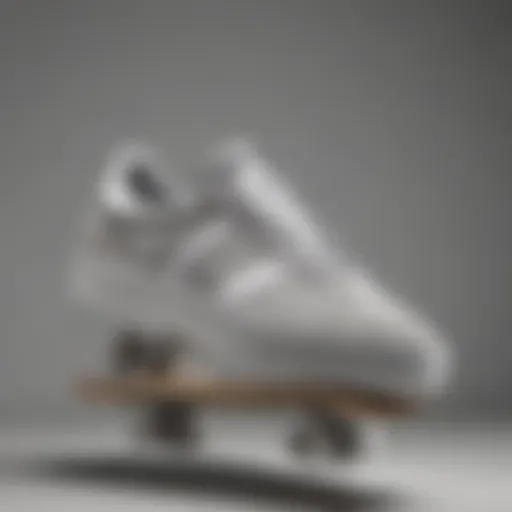 A stylish pair of grey and white Adidas sneakers on a skateboard