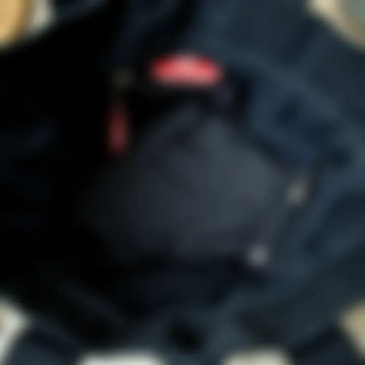 Interior Layout of Vans Tote Bag Functional interior of the Vans black canvas tote bag displaying compartments and storage options.