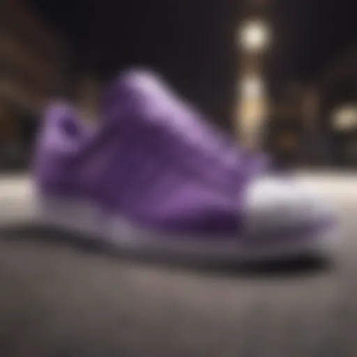 A close-up view of the Purple Shell Toe Adidas showcasing its unique design features.