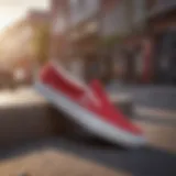 A stylish pair of red slip-on Vans on a skateboard